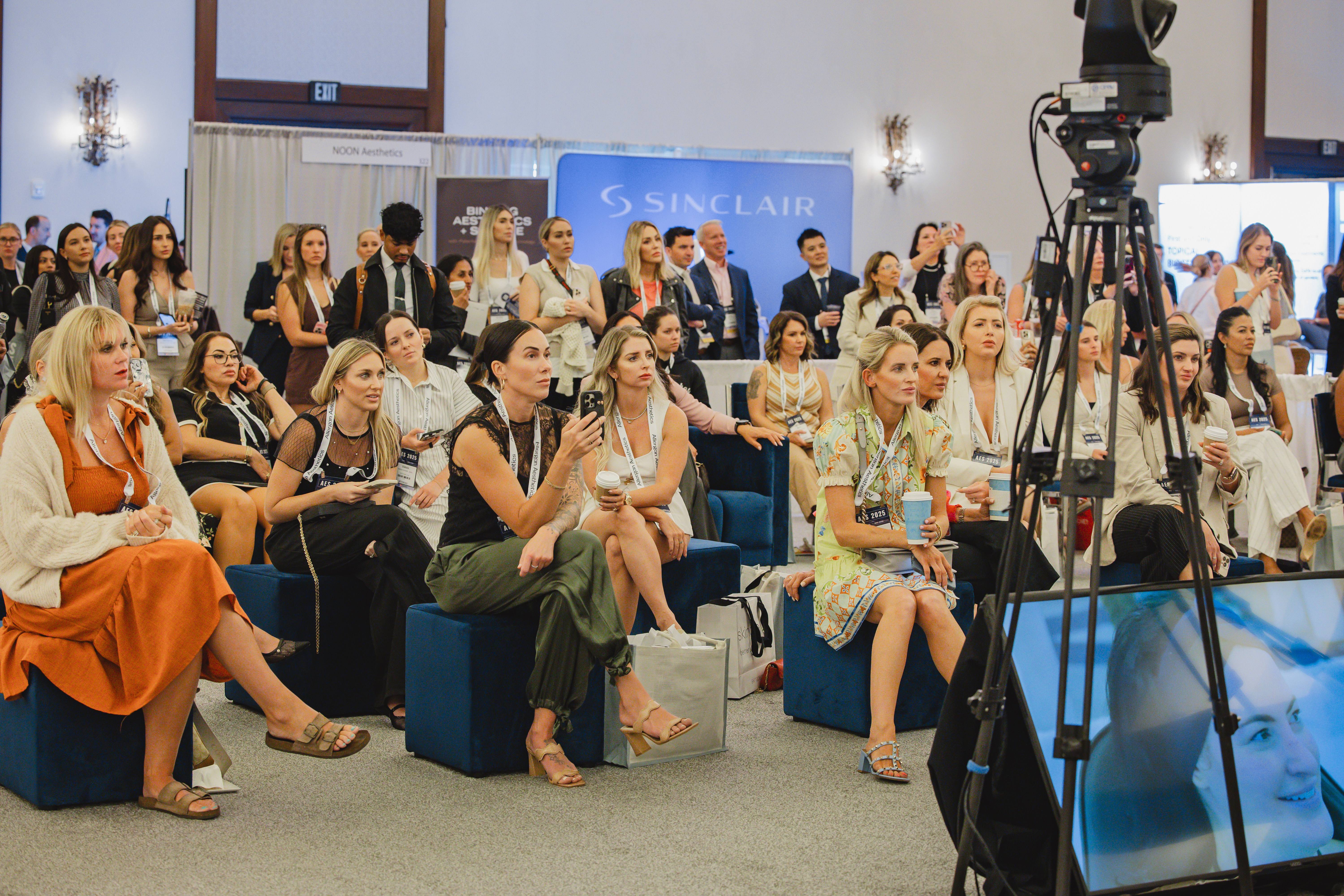 Attendees watching an AES Mosh Pit presentation